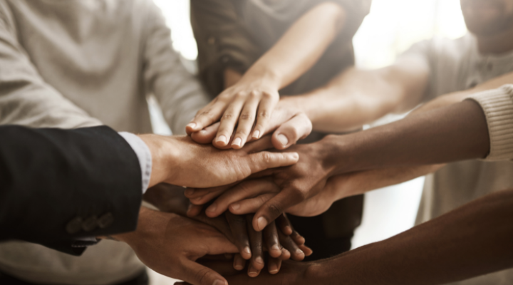 people putting hands together