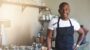 Business owner stands in the kitchen of his restaurant