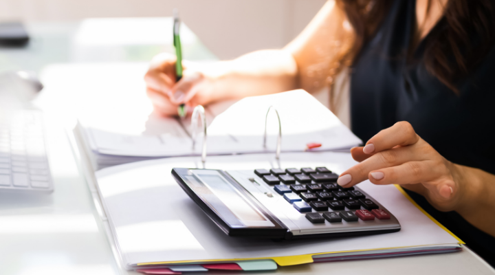 tax accountant using calculator